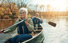 happy-seniors-canoeing-together-in-nature-photo.jpg